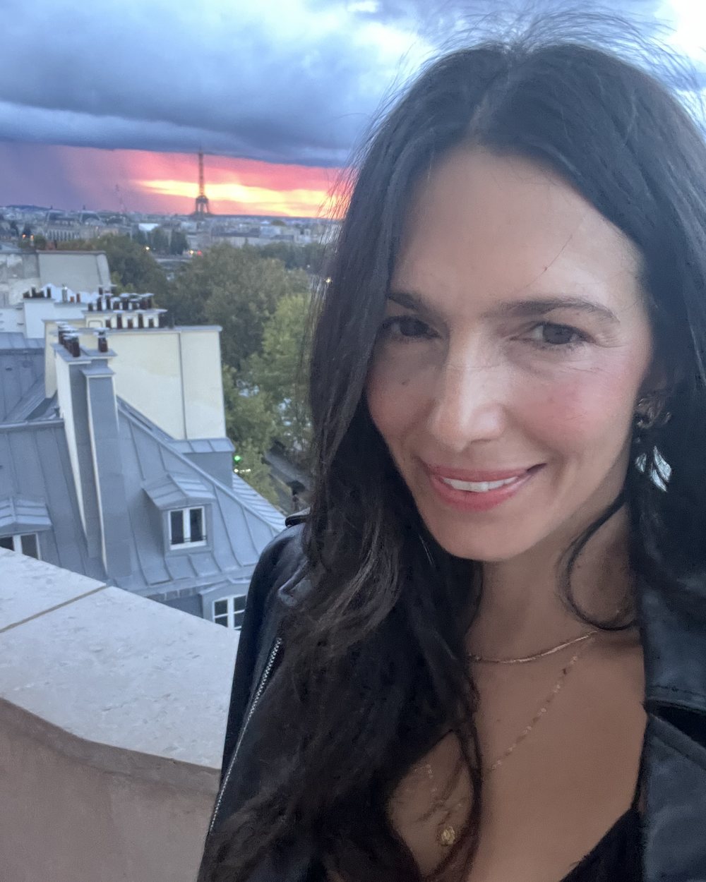 Jessica L. Rutter, founder of The Modern AI Club, on a Paris rooftop at sunset